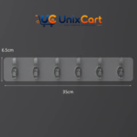 Clear adhesive hook rail holding stainless steel spatulas and whisks above kitchen counter