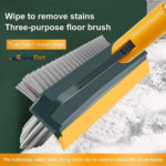 Rubber squeegee wiper clearing water from tiles