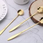 Golden spoons set for a party table setting