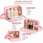 Three clear travel wash bags packed neatly inside an open suitcase compartment