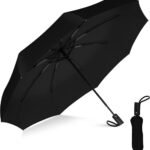Umbrella open in rain showing windproof frame